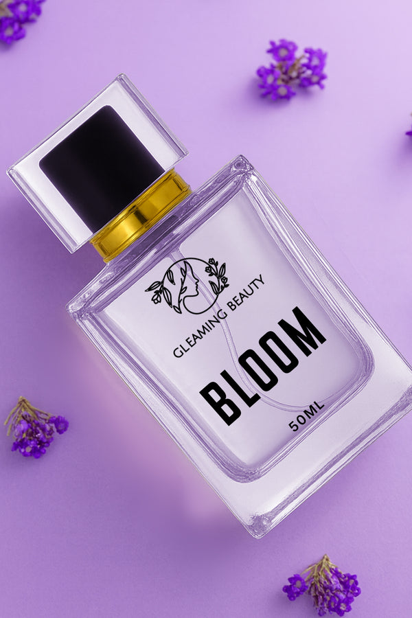 Perfume bottle labeled 'Bloom' by Cleaming Beauty on a purple background with flowers.